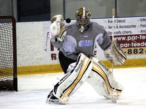 Sarnia Sting goaltender J.P. Anderson makes a glove save during practice Thursday, Jan. 3, 2012 at the RBC Centre in Sarnia, Ont. PAUL OWEN/THE OBSERVER/QMI AGENCY