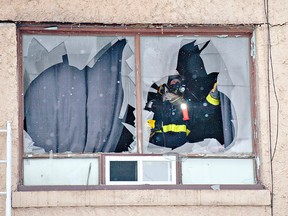 BRIAN THOMPSON, The Expositor

A Brantford firefighter checks the interior of a second-storey apartment at 401 Grey St. on Thursday.