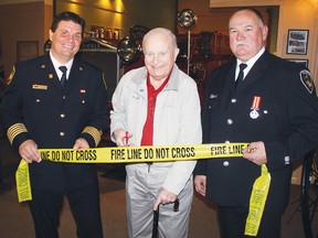 Observer file photo
Former Pembroke fire chief Arnold O’Kane (centre) was on hand to cut the ribbon for the official opening of the Fire Station No.3 exhibit at the Champlain Trail Museum in April 2012. O’Kane passed away Jan. 1., 2013.