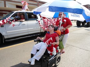 Tanya Nooyen of the Chatham-Kent Block Parent Program Inc. strolls with Kim Lang in the 2012 Canada Day Parade. The program is one of the members of the United Way family of agencies.