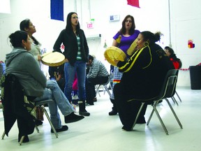 Alice Chisel and Karen Allen circle the drums holding staffs at a Nechee Friendship Centre ceremony, urging the creator to protect Treaty 3.
JON THOMPSON/Daily Miner and News