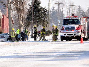 Chatham-Kent firefighters and paramedics help a person from one of three vehicles involved in a crash on Highway 40 north of Chatham Friday January 04,2013. Three people were sent to hospital with non-life threatening injuries. DIANA MARTIN/ THE CHATHAM DAILY NEWS/ QMI AGENCY