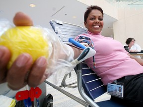 Patricia Osadciw, receptionist for the Mayor's office at City Hall, donates blood during a blood drive at City Hall.