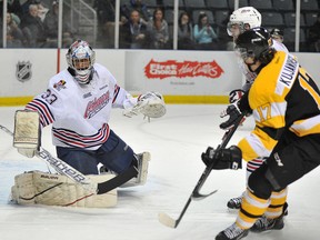 Kingston Frontenacs’ Ryan Kujawinski fires a shot at Oshawa Generals goalie Daniel Altshuller during an Ontario Hockey League game at the K-Rock Centre on Friday night. (Jeff Peters/For The Whig-Standard)