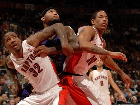 TORONTO, CANADA - JANUARY 4: Ed Davis #32 (L); DeMarcus Cousins #15 (C) ;DeMar DeRozan #10 (R) all try to gain position for the rebound during the game on January 4, 2013 at the Air Canada Centre in Toronto, Ontario, Canada. NOTE TO USER: User expressly acknowledges and agrees that, by downloading and or using this Photograph, user is consenting to the terms and conditions of the Getty Images License Agreement. Mandatory Copyright Notice: Copyright 2013 NBAE   Ron Turenne/NBAE via Getty Images/AFP
