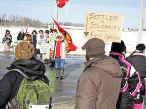 The Idle No More movement is garnering support from a growing number of people across the country in response to the Canadian government's implementation of the controversial Bill C-45, as well as a perceived lack of transparency from the Stephen Harper government. Supporters at an Idle No More demonstration in Timmins on Saturday said that the main issues aren't likely to disappear, even after the announcement was made for an upcoming meeting between First Nations representatives and the Prime Minister on Jan. 11. 

Photo taken on Saturday, Jan. 5, 2013 in Timmins. BENJAMIN AUBÉ/THE TIMMINS DAILY PRESS/QMI AGENCY