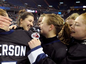 The Edmonton Thunder celebrate after winning the Mac's tournament in Calgary on Jan. 1, 2013.