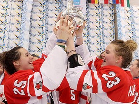 Belleville's Hanna Bunton, left, celebrates with teammate Karly Heffernan of Alberta after Team Canada beat the U.S. 2-1 in the gold medal final of the U18 world women's hockey championships in Finland last weekend. (Phillip MacCallum/HHOF and IIHF.)