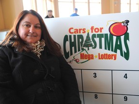 Fourth place Cars for Christmas winner Myriam Miller was the first to pick up her prize at the lottery draw held at Centre 2000. (Aaron Hinks/Daily Herald-Tribune)