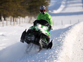 Austin Valiquette rips it up on a snowmobile along Township Road 704, the road near the Wapiti Nordic Ski Club, in the County of Grande Prairie on Sunday. The current bout of warmer weather made getting out to enjoy the snow that much easier this weekend. (Aaron Hinks/Daily Herald-Tribune)