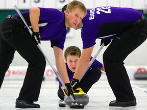 Jason Camm, who throws last for the Aaron Squires skipped team delivers a rock in the final of the 2013 Pepsi Junior Provincial Curling Championships Sunday Jan 6. 2013 at the Highland Country Club.  The Squires rink won 9-5 over the Chris Lewis skipped club from Ottawa.
Sweeping are brothers David and Curtis Easter(l-r). The team curls out of the St. Thomas Curling Club. (MIKE HENSEN, The London Free Press)