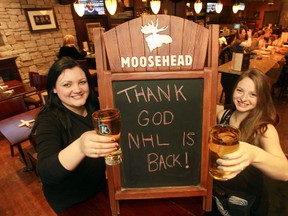 Pub workers Holly Lockwood and Yvonne Lefebure pose for a photo at Sir John A Pub in Ottawa, Ont. Sunday Jan 6, 2013. Pubs and businesses across Ottawa have been hurting during the NHL lockout. Tony CaldwellOttawa Sun/QMI Agency