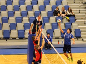 Huskies Albert Spyker tips a shot against the Grant MacEwan Griffins in ACAC exhibition volleyball action Saturday at the Syncrude Sport and Wellness Centre.  TREVOR HOWLETT/TODAY STAFF