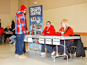 Kara Wilson, for The Expositor
                   
Marcus Beal inquires about job openings at the Wayne Gretzky Sports Centre and Earl Haig booth during a summer and season job fair Saturday at the civic  centre auditorium.