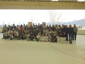 St. Thomas Aquinas Saints and Taos Tigers boys hockey teams played a combined game to wrap up the Saints trip to Taos, New Mexico Jan. 4-6. The teams pose at the open end of the arena overlooking the mountain area in northern New Mexico.
HANDOUT PHOTO/St. Thomas Aquinas Saints