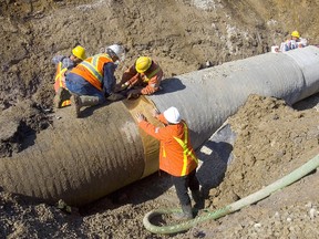 The pipeline being repaired Wednesday is similar to the one picture here that broke near Mount Carmel in May 2012, flooding farmland and prompting water supply warnings from Grand Bend to London. (Free Press file photo)
