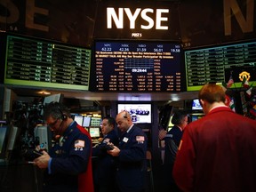 Traders work on the floor of the New York Stock Exchange in New York, Jan. 4, 2013.   REUTERS/Eric Thayer