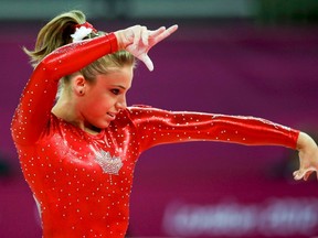 Canada's Dominique Pegg performs her floor exercise during the women's gymnastics team final in the North Greenwich Arena at the London 2012 Olympic Games July 31, 2012.   MARK BLINCH/REUTERS