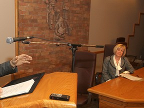Brenda Hunter, right, director of education for the Limestone District School Board, listens Monday morning as MPP John Gerretsen announces the province is providing $9 million towards a new north-end elementary school.
Michael Lea The Whig-Standard