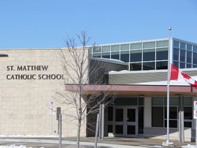 St. Matthew Catholic School in Sarnia, Ont. flew its flag at half-mast to honour late teacher Noelle Paquette Monday, Jan. 7, 2012. The kindergarten teacher's body was found in a woodlot last Wednesday. Michael MacGregor, 19, and Tanya Bogdanovich, 31, both of Sarnia, have been charged wth first degree murder. (BARBARA SIMPSON, The Observer)