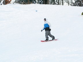 Kalin Laventure takes advantage of the cooler weather to practice his snow boarding at the Tobaggan Hill on Dec. 27.