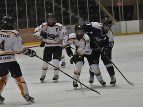 Saints defenceman Sydney Taylor eyes the puck. (Kevin Hirschfield/PORTAGE DAILY GRAPHIC/QMI AGENCY)