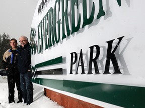 Evergreen Park general manager Dan Gorman (left) and Don Moon, sponsorship and marketing manager stand by a sign at Evergreen Park. (DHT file photo)