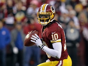 Washington Redskins quarterback Robert Griffin III looks to pass against the Seattle Seahawks during their NFL NFC wildcard playoff game in Landover, Maryland January 6, 2013. (LAURENCE KESTERSON/Reuters)