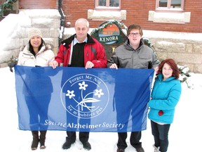 January is Alzheimer Awareness Month in Kenora and Mayor Dave Canfield is joined by Alzheimer Society of Kenora/Rainy River Districts representatives Rossana Tomashowski (left), Ashton Faules and Tiffany Garrow for the official flag raising at City Hall, Wednesday, Jan. 2, 2013.
REG CLAYTON/Daily Miner and News