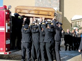 Members of the Pembroke Fire Department lift the casket of Arnold O’Kane onto the back of the city’s pumper truck following the funeral mass for the former Fire Chief Saturday at Our Lady of Lourdes Church in Pembroke. Members of O’Kane’s family are looking on. For more community photos, please visit our website photo gallery at www.thedailyobserver.ca.