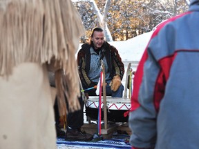 Mike Richards plays a drum during Monday morning’s chilly Idle No More demonstration outside the Algonquins of Ontario office on Riverside Drive in Pembroke. For more community photos please visit our website photo gallery at www.thedailyobserver.ca.