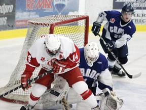 TINA PEPLINSKIE tina.peplinskie@sunmedia.ca
Pembroke Lumber Kings' forward Stephen Hrehoriak and Cumberland Grads' goalie Reilley Turner try to find the loose puck during first period action at the PMC Sunday night. The Kings opened 2013 on a losing note as they fell 5-4 to the Grads. For more community photos, please visit our website photo gallery at www.thedailyobserver.ca.