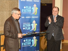 Elliot Lake Mayor Rick Hamilton applauds after Tony Clement, Minister for FedNor, made the first of two funding announcements for the city on Tuesday, Jan. 8. 
Photo by KEVIN McSHEFFREY/THE STANDARD/QMI AGENCY