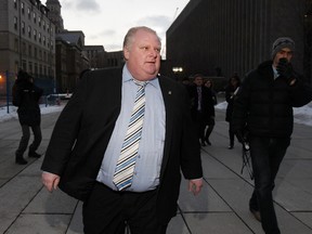 Toronto Mayor Rob Ford leaves Osgoode Hall after a day-long proceeding appealing the court's guilty decision on his conflict of interest charge, Monday, Jan. 7, 2013. (Stan Behal/Toronto Sun)
