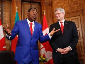 Canada's Prime Minister Stephen Harper listens as Chairman of the African Union and Benin's President Thomas Yayi Boni speaks during a meeting in Harper's office on Parliament Hill in Ottawa January 8, 2013.  REUTERS/Chris Wattie