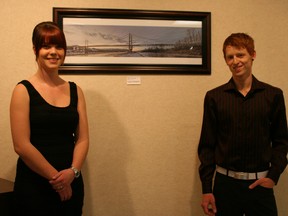 Jennifer and Jaydon Hudson, two aspiring photographers at the opening night of their photography exhibit at the Fairview Fine Arts Centre on Friday, Jan. 4, 2013. The exhibit is open Tuesdays to Saturdays for the entire month of January. (Simon Arseneau/Fairview Post)