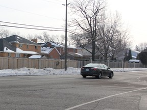 Crossing guard Claude Bourque watches for students at the intersection of Cathcart Boulevard and Murphy Road in Sarnia, Ont. Tuesday, Jan. 9, 2012. Cathcart Boulevard student Jillian Keck, 10, died after being hit by a vehicle at this intersection Monday afternoon. She and her little sister were walking behind a crossing guard when she was hit, witnesses say. (BARBARA SIMPSON, The Observer)