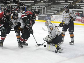 TERRY FARRELL/DAILY HERALD-TRIBUNE
Storm goalie Mason Gould stands his ground against Lion captain Tyler Benson. The Grande Prairie Storm hosted the South Side Athletic Club Lions in Alberta Major Bantam Hockey League action over the weekend.