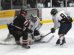 Storm goalie Tyson Walker turns away Lions captain Tyler Benson, with Storm defenceman Simon Spenner there to clear the rebound. The Grande PrairieStorm hosted the South Side Athletic Club Lions in Alberta Major Bantam Hockey League action at the Coca-Cola Centre,