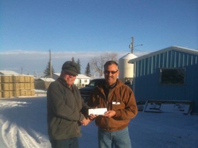 Nanton Mayor John Blake purchased the first ticket for the cash calendar from Nanton Curling Club President Doug McDonald