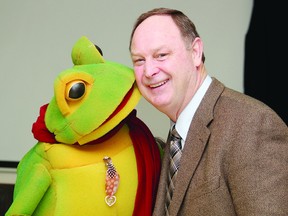 TINA PEPLINSKIE tina.peplinskie@sunmedia.ca
Renfrew-Nipissing-Pembroke MPP John Yakabuski gets a big ‘thank you’ kiss from Bonnie Chere, spokesfrog for those who live in the Bonnechere River watershed. The Fostering Stewardship Innovation project was launched Monday in Eganville. For more community photos, please visit our website photo gallery at www.thedailyobserver.ca.