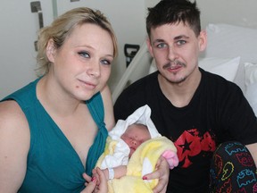 Proud parents Valerie Pelky and Shawn Kelly pose with their newborn daughter Peyton at St. Joseph’s General Hospital in Elliot Lake on Wednesday, Jan. 2.
Photo by JORDAN ALLARD/THE STANDARD/QMI AGENCY