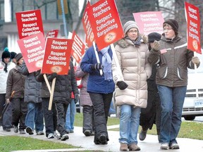 SCOTT WISHART The Beacon Herald
Hundreds of public elementary school teachers including these picketers at Stratford Central took part in a one-day walkout from Avon Maitland District School Board schools in December.