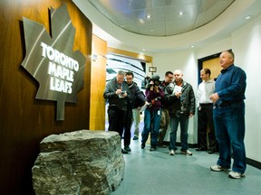 Toronto Maple Leafs head coach Randy Carlyle gives the media a tour of the revamped Leafs dressing room at the Air Canada Centre in Toronto on Monday. He talks about the large rock from Wiarton at the entrance. Ernest Doroszuk/QMI Agency