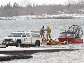 Firefighters participate in a search on the St. Mary's River earlier this winter.
