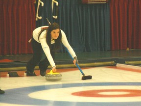 Airdrie’s Heather Jensen slides out of the hack while, right, she calls to her sweepers during the Southern Alberta women’s curling playdowns at the Glencoe Club in Calgary on Jan. 5. Jensen failed to qualify for the provincials, losing to Cheryl Bernard in the C event semifinals.