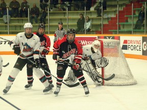 Connor Boyd of the UFA Bisons, right, tries to screen the Okanagan Rockets goaltender during the Bisons’ 5-3 loss at the Mac’s AAA Midget Hockey Tournament at the Father David Bauer Arena on Dec. 30.
CHRIS SIMNETT/AIRDRIE ECHO