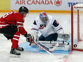 Canada’s Ty Rattie, an Airdrie native, goes to the net on Team USA’s goalie John Gibson during the first period of their preliminary round game at the 2013 IIHF U20 World Junior Hockey Championship in Ufa, Russia on Dec. 30. Rattie scored three goals in the tournament while Canada finished fourth.
MARK BLINCH/REUTERS
