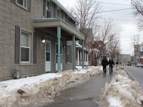 Students walk on Division Street near Queen's University Wednesday. A string of break-ins were reported when students returned to nearby residences following the holiday.
Danielle VandenBrink/The Whig-Standard