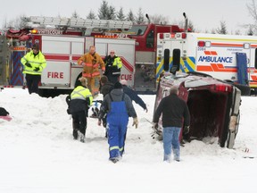 B=One person is taken en route to hospital as police, EMTs and firefighters respond to this rollover which occurred along Highway 43 at about 11 a.m. Wednesday, Jan. 9. It was among multiple collisions and a report of an RCMP search for a person in the Blue Ridge area.                                                   Barry Kerton | QMI Agency